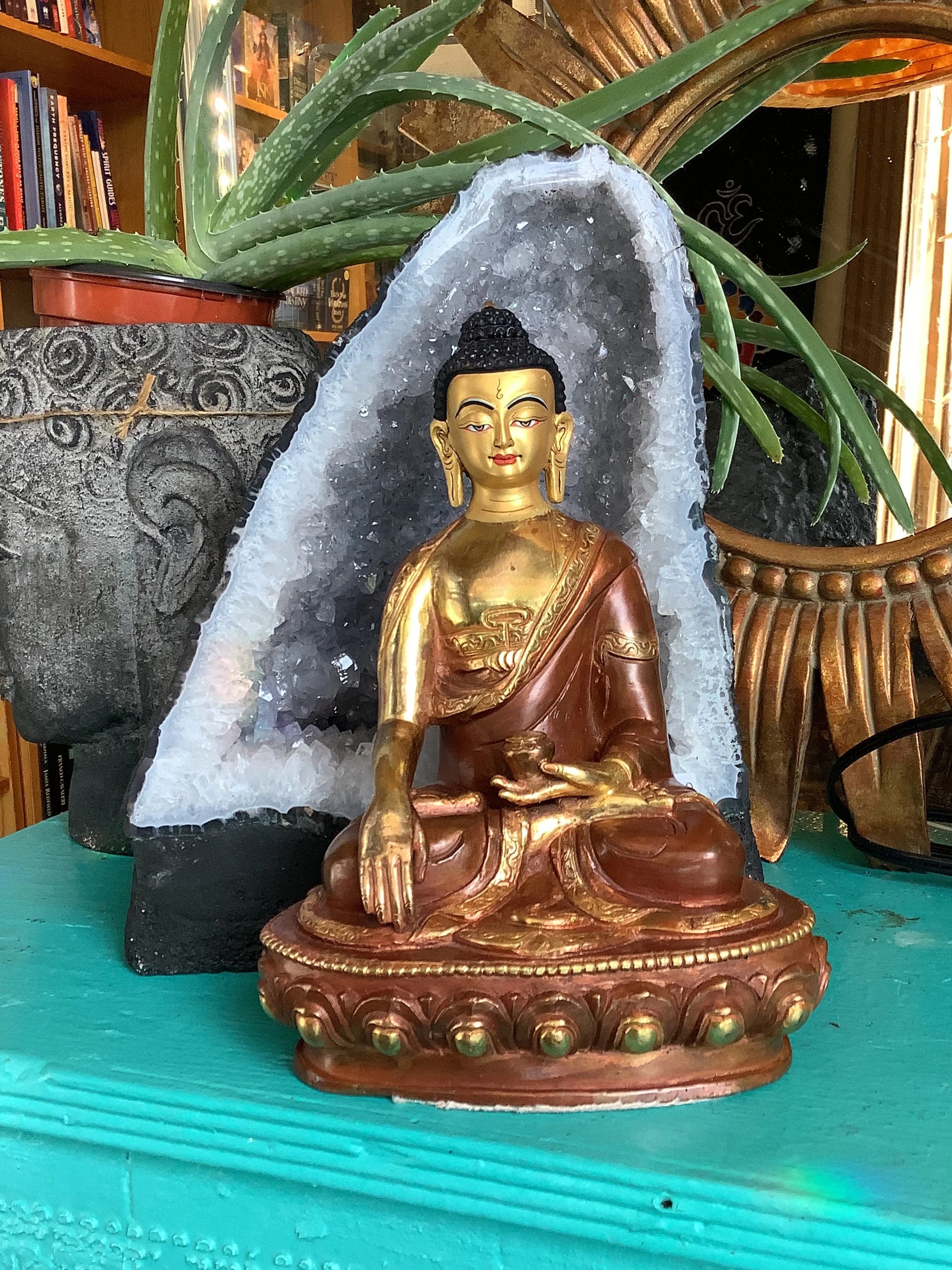 Copper and gold healing Buddha statue at Utopia Store